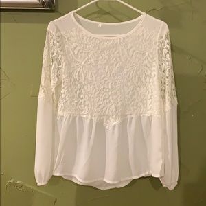 White shirt with lace overlay on the top.